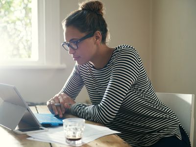 Woman comparing personal loans on her computer