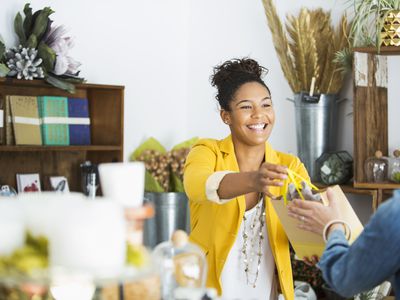 A young employee assists a customer.