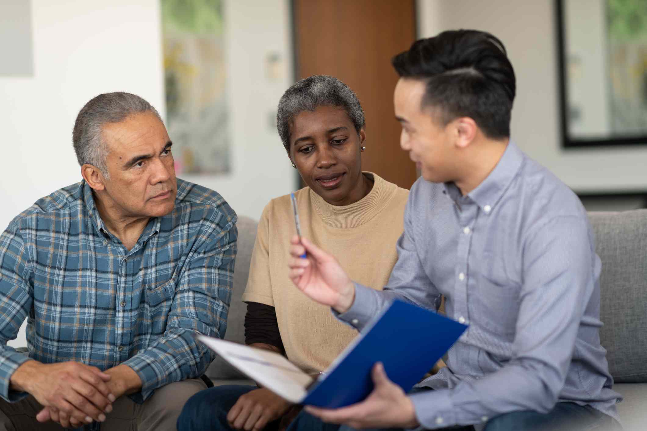 A couple are in a meeting with a financial advisor.