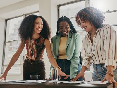 Three business women collaborating