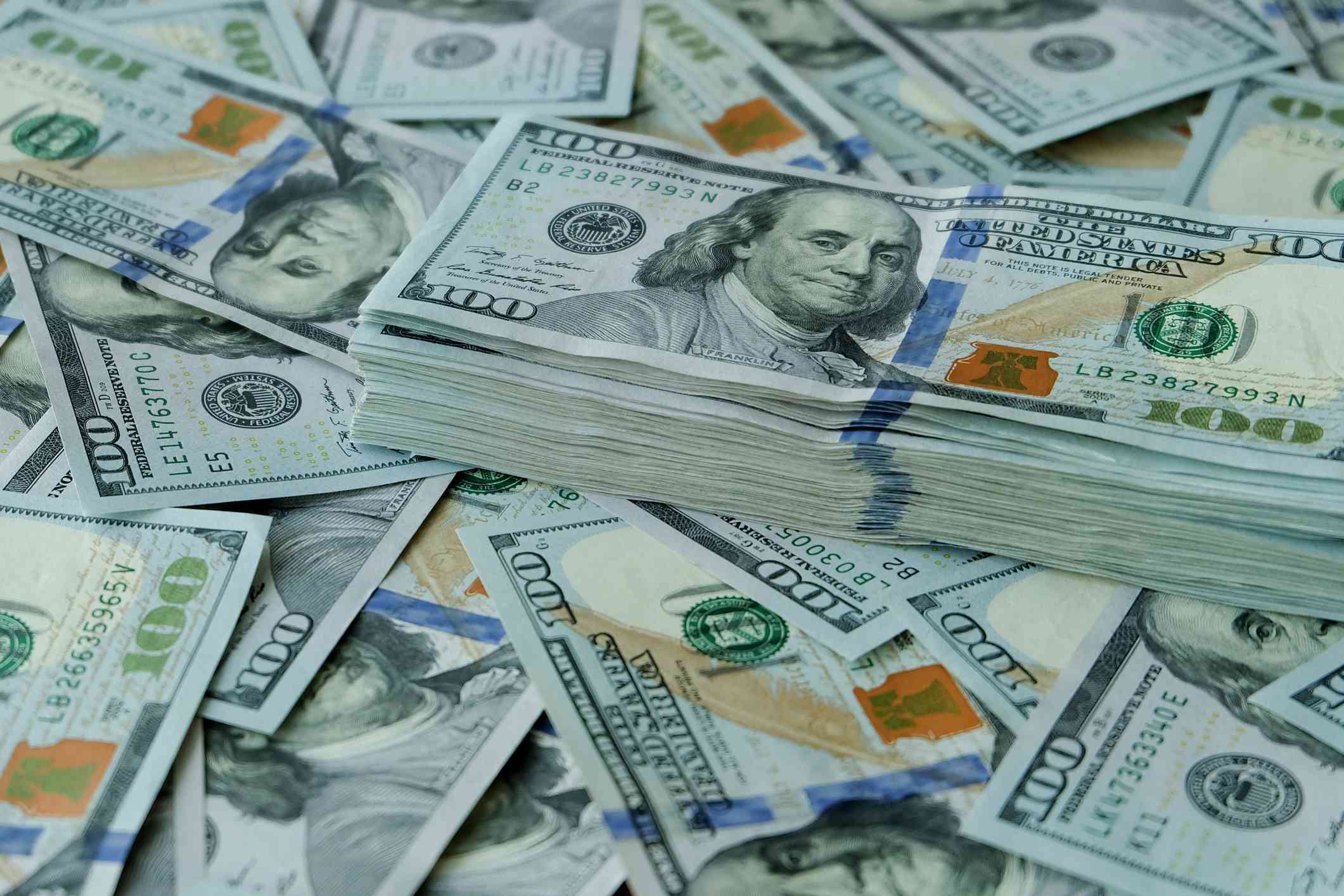 stacks of U.S. $100 notes