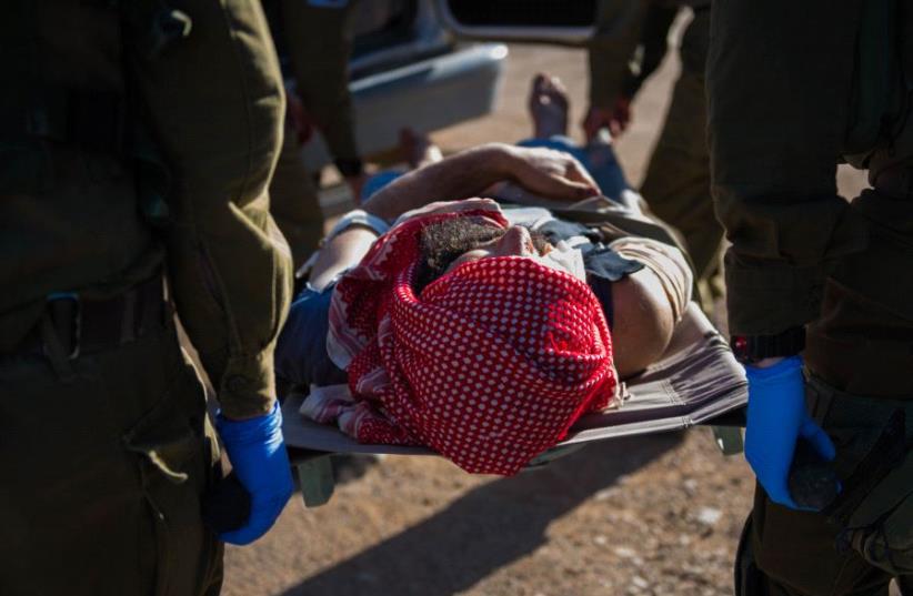 IDF troops provide medical aid to Syrian civilians (photo credit: IDF SPOKESMAN’S UNIT)