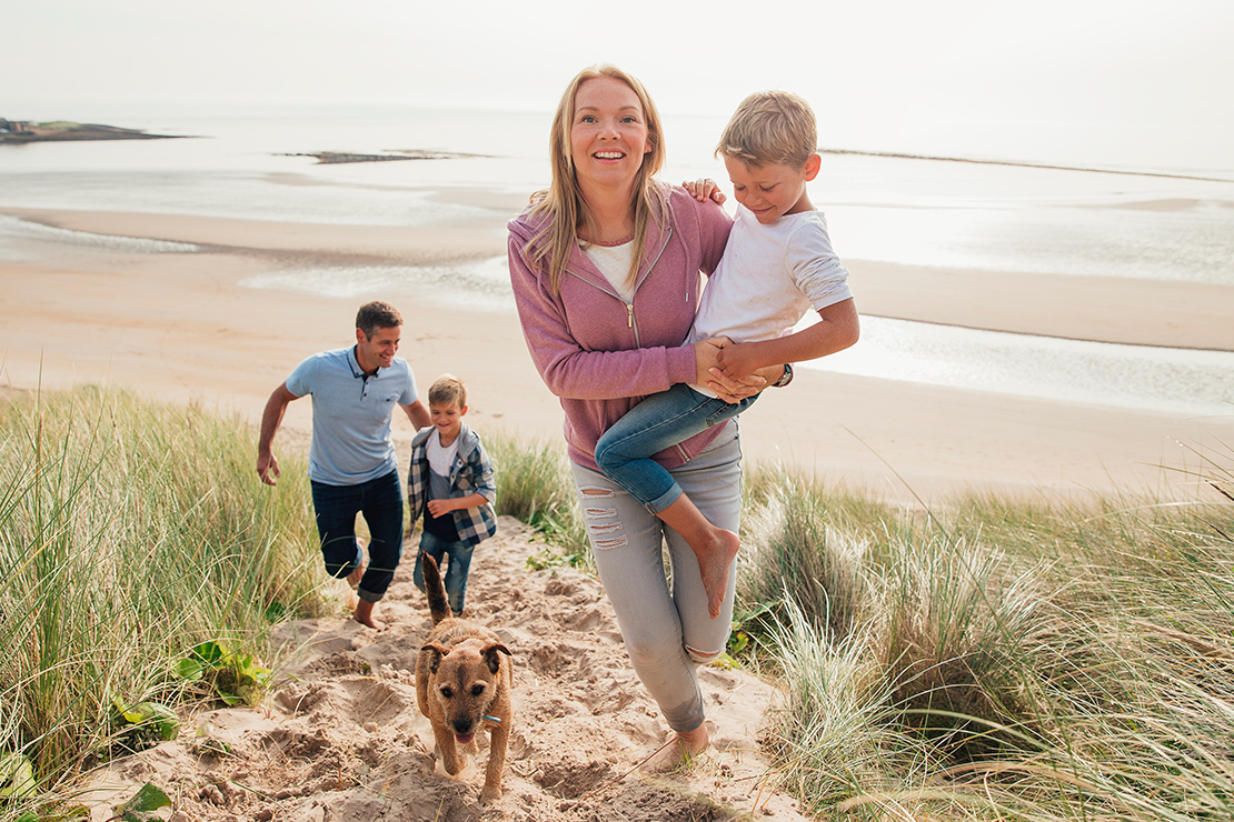 a family at the beach is an example of rogers gray target audience for insurance