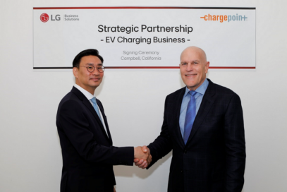 A photo of LG Electronics (left) and ChargePoint (right) representatives shaking hands with each other