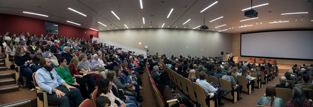 Panorama of Hunt Auditorium filled with people