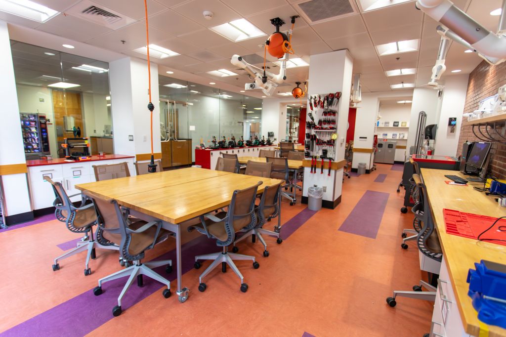 Large work tables and a pegboard with tools