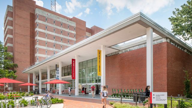 Hill library, a brick building with busy plaza