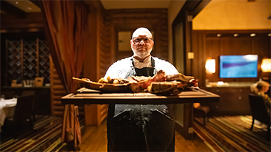 chef holding steak