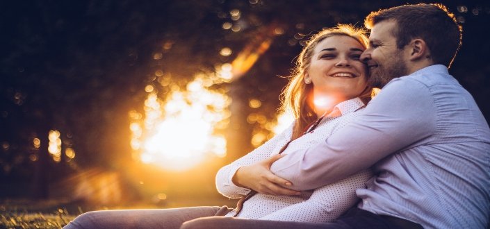 man hugging a woman