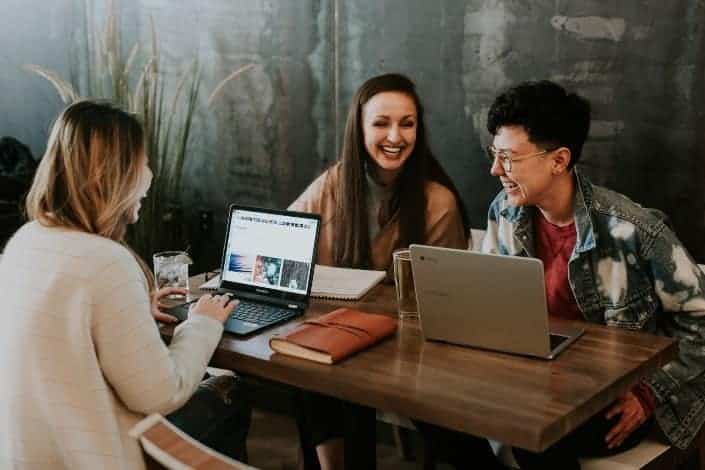 Office workers laughing together