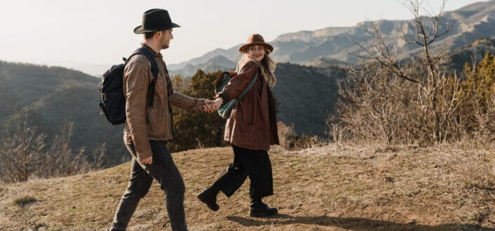 Couple going on a hike holding hands