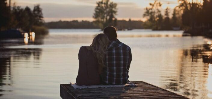 Man and Woman Leaning on Each Other