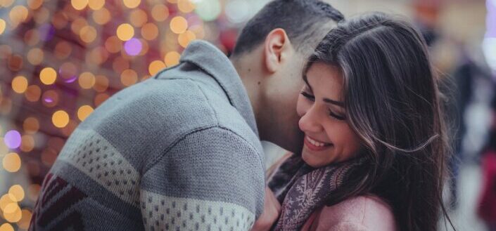 boyfriend kissing his girlfriend on the cheek