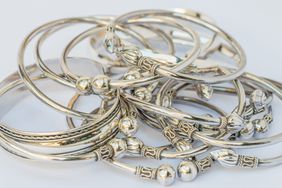 grouping of silver bracelets