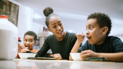 Parent having breakfast with kids