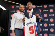 Detroit Pistons president of basketball operations Trajan Langdon, left, poses with Draft pick Ron Holland at an NBA basketball news conference in Detroit, Friday, June 28, 2024. (AP Photo/Paul Sancya) AP