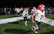 Clinton players take the field during a MHSAA regional final high school football game at Lumen Christi High School on Friday, Nov. 10, 2023. Lumen Christi won the game over Clinton, 21-14.