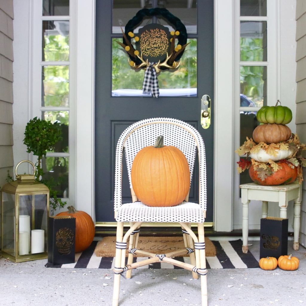 fall front porch with pumpkins