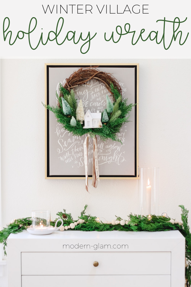 Make this fun and whimsical winter village wreath. Easy minimalist winter wreath with bottlebrush trees and a putz house. Diy Christmas wreath. via @modernglamhome