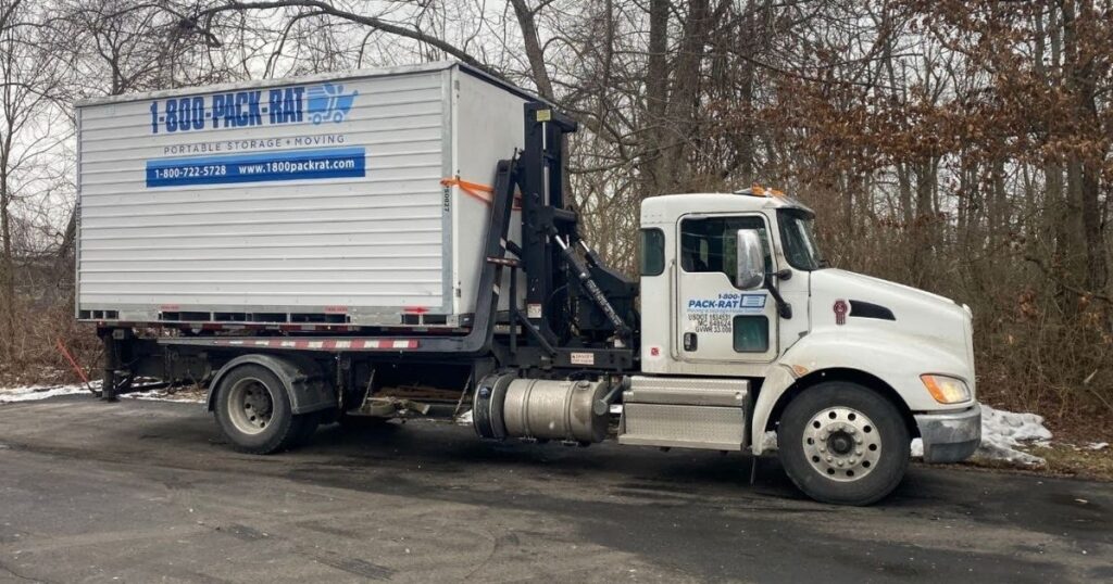 1-800-PACK-RAT container being picked up