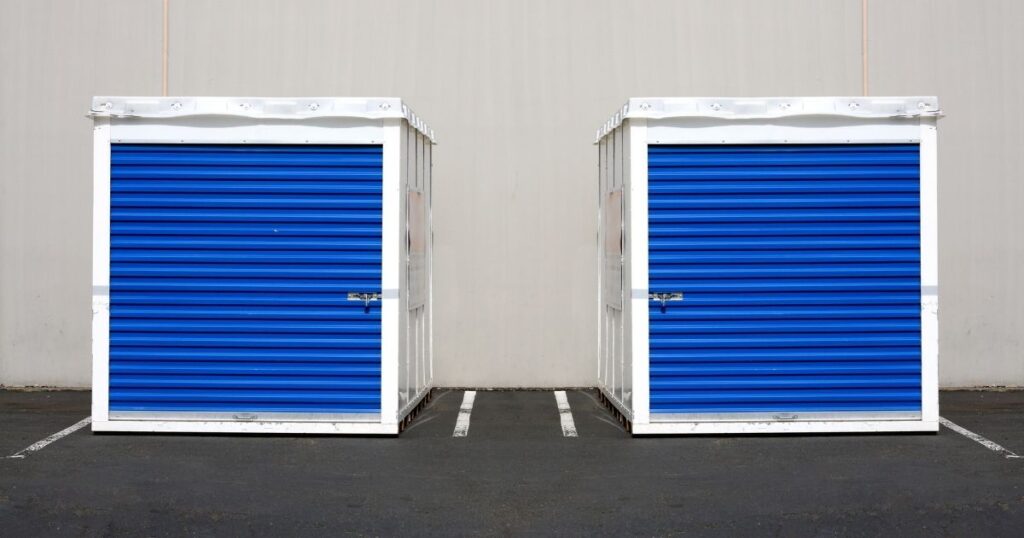 Two moving containers sitting next to each other