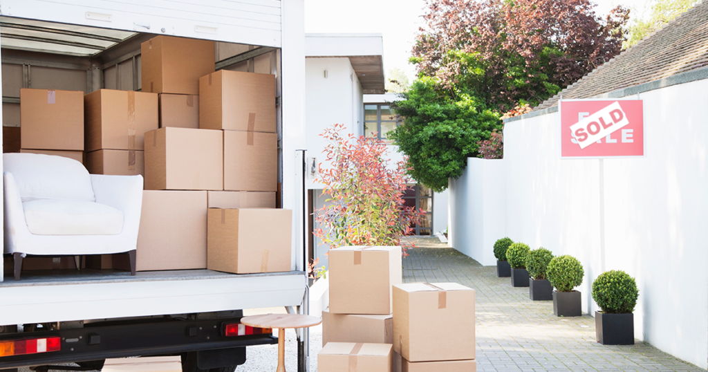 moving boxes being packed into a truck