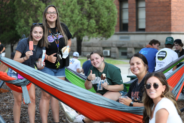 !Students hang out and eat ice cream at orientation. 