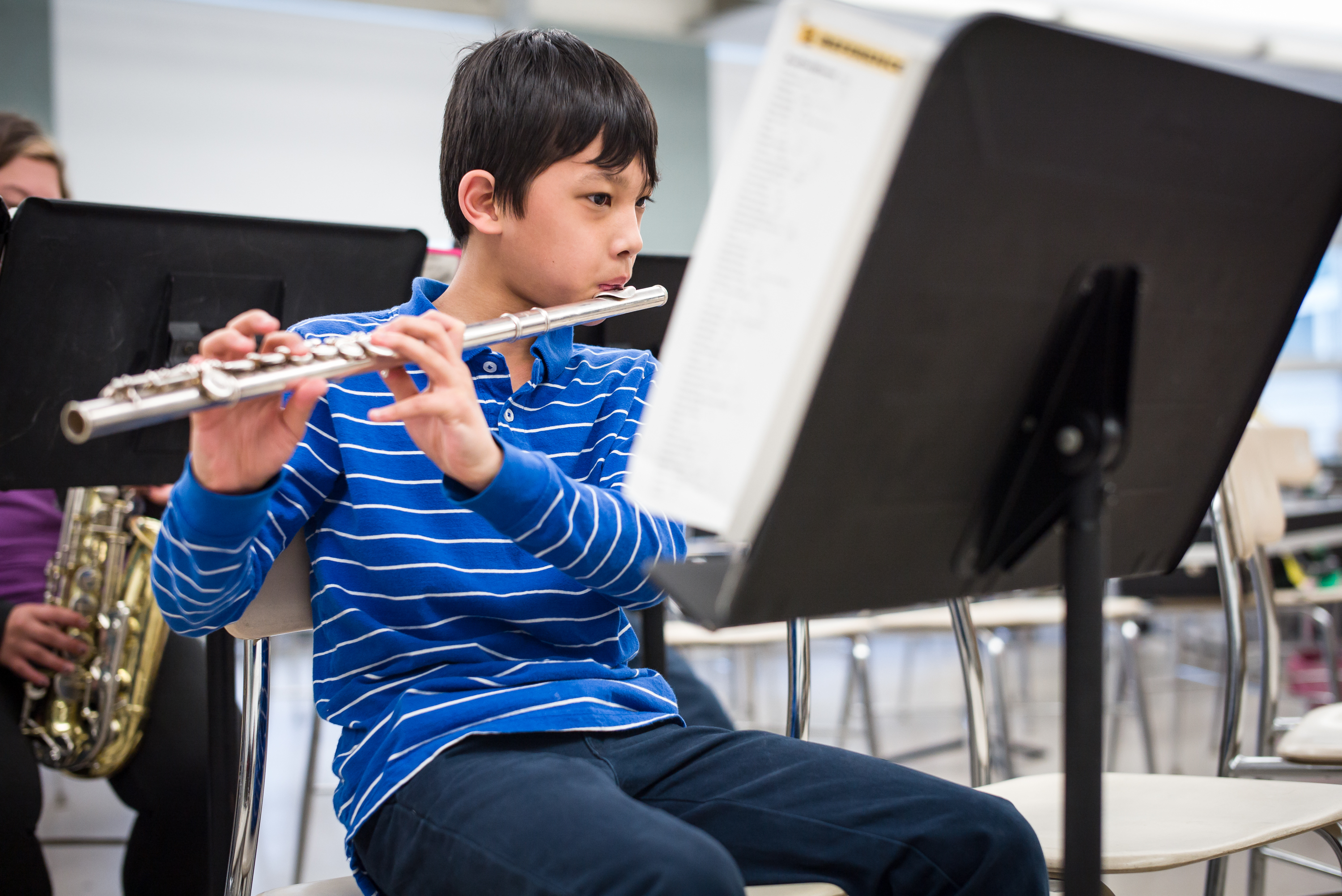 Elementary School Student Playing the Flute