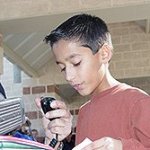 A student at Lamar Elementary School in Greenville, Texas, proudly talks to an astronaut in space.