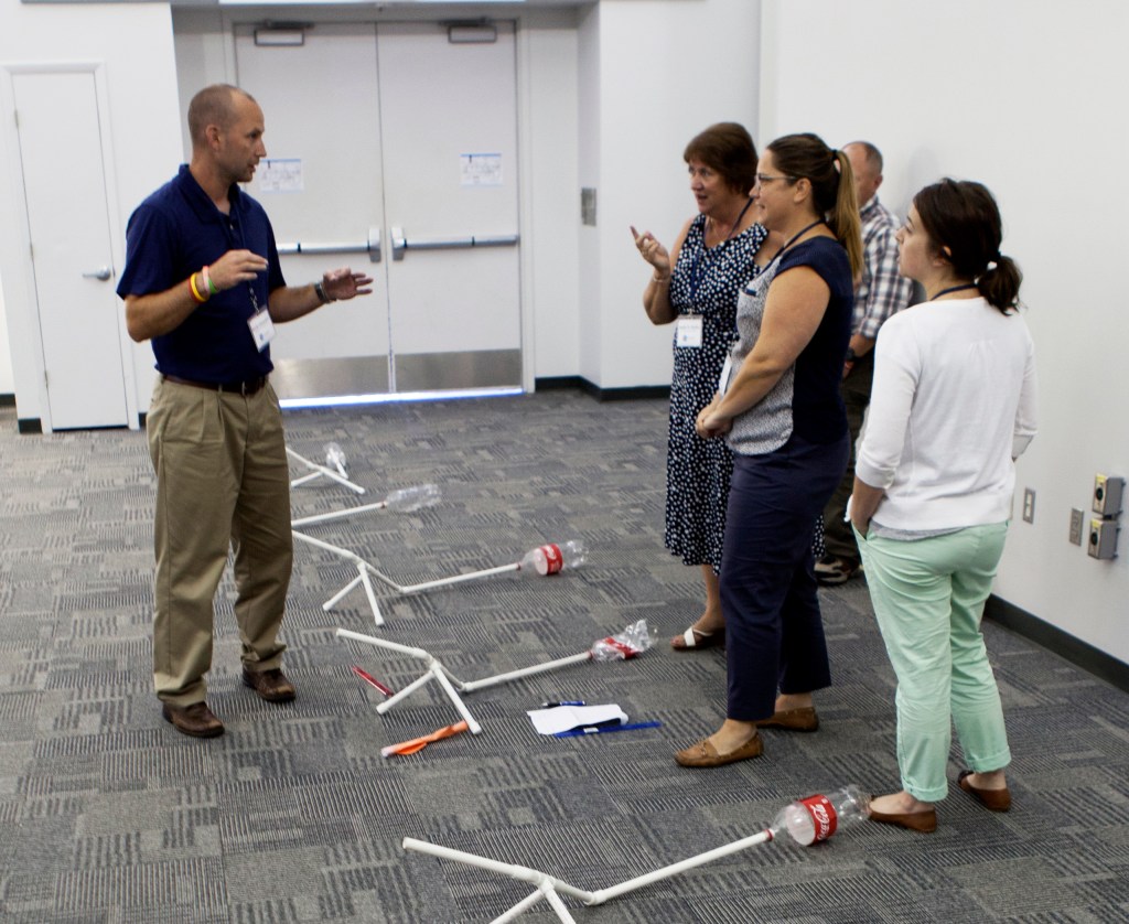 Educators Grades 9-12 prepare to demonstrate the projects they built