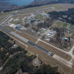 Aerial image of NASA's Wallops Flight Facility main base, with two long air strips with buildings surrounding it.