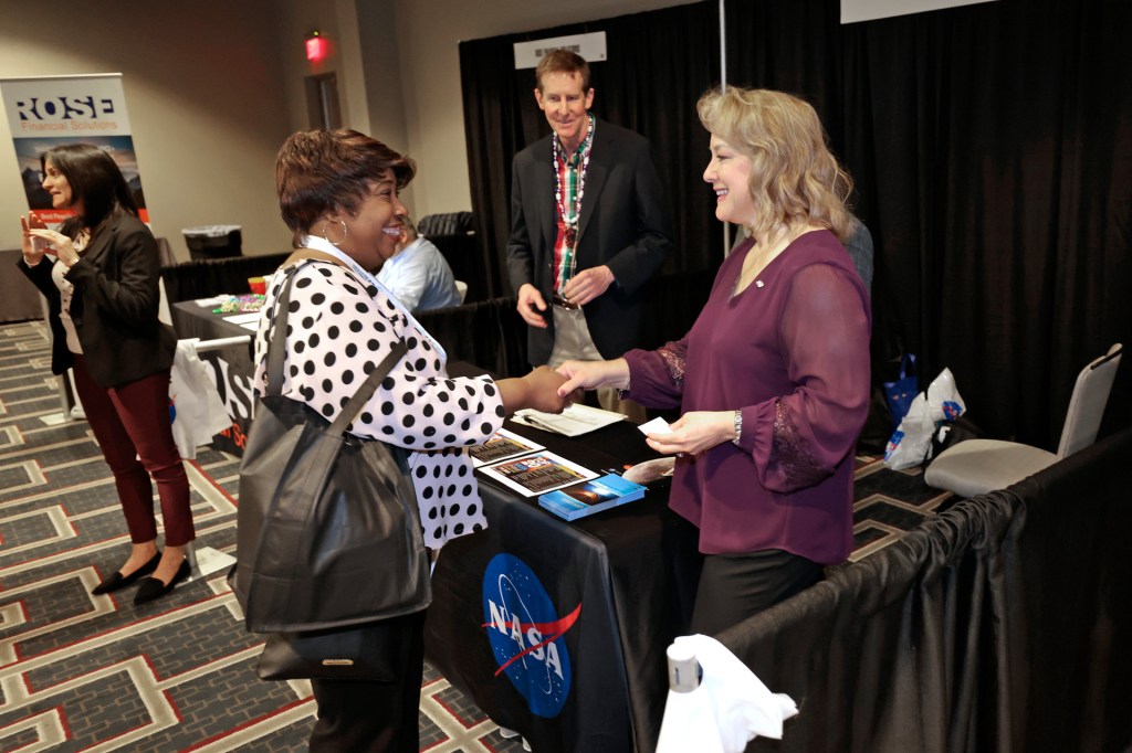 Office of Small Business in person event with lady shaking hands