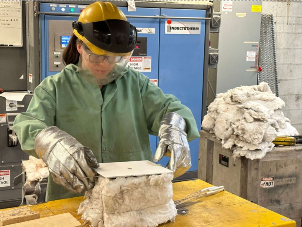 Student from Missouri University of Science and Technology working on the team's lunar forge project in the 2023 BIG Idea Challenge.