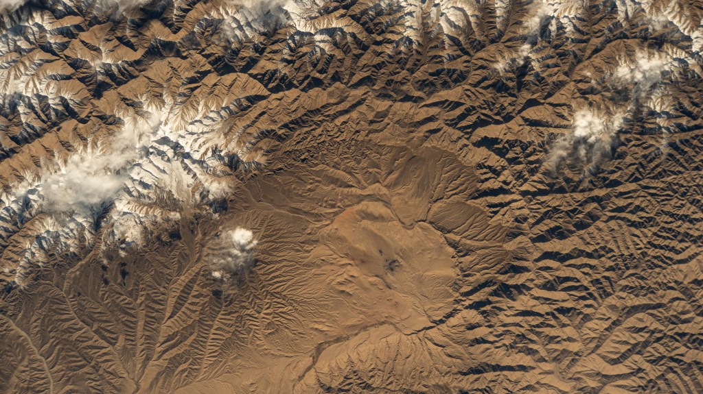 iss068e017473 (Oct. 18, 2022) --- A portion of the Kunlun Mountains, one of the longest mountain ranges in Asia, in southwestern China is pictured from the International Space Station as it orbited 262 miles above.