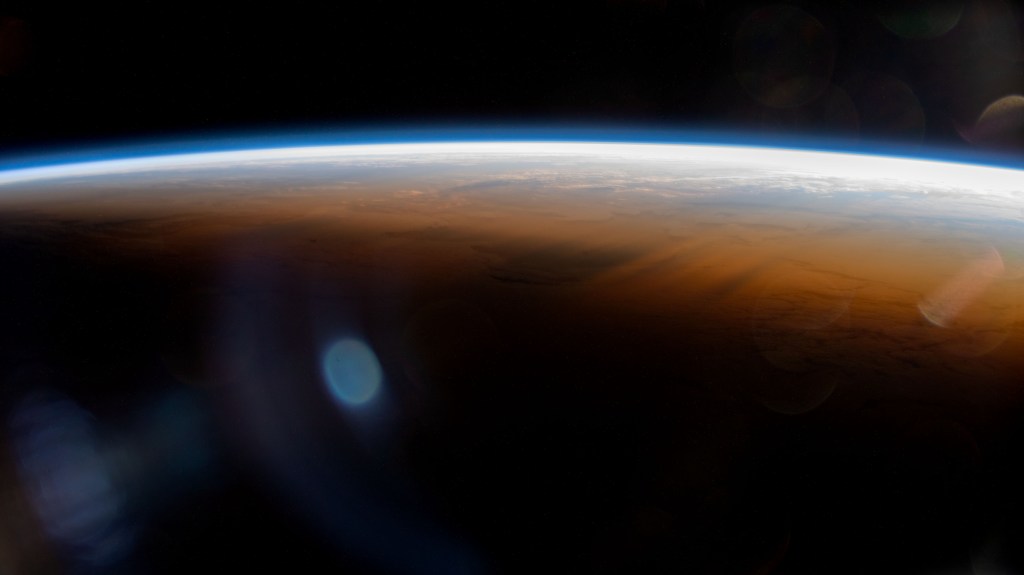 iss068e068975 (March 6, 2023) --- The International Space Station orbits 264 miles above the Atlantic Ocean off the coast of Namibia and into an orbital sunset marked by the terminator, or the line separating day from night on Earth.