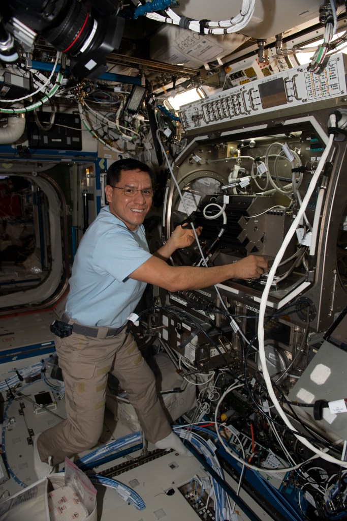 iss068e024574 (Nov. 26, 2022) --- NASA astronaut and Expedition 68 Flight Engineer Frank Rubio works in the Microgravity Science Glovebox setting up hardware for the Pore Formation and Mobility Investigation. The space physics study demonstrates a passive cooling system for electronic devices in microgravity using a micro-structured surface.