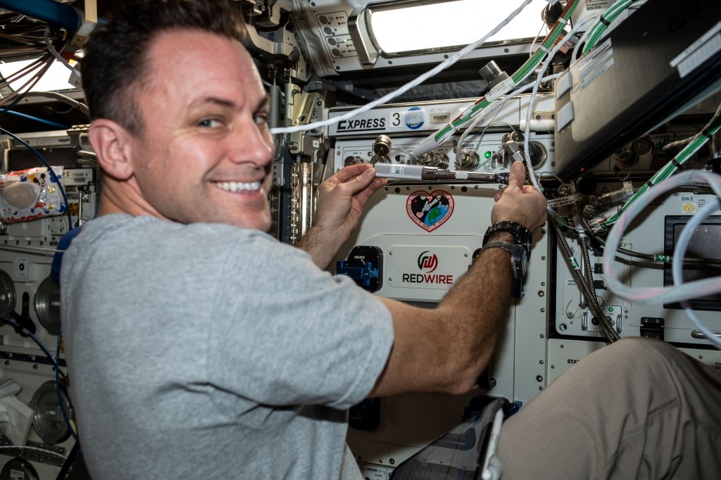 iss068e043943 (Jan. 31, 2023) --- NASA astronaut and Expedition 68 Flight Engineer Josh Cassada is pictured installing the BioFabrication Facility (BFF), a research device that will be used to investigate the 3-D printing of human organs in microgravity. The BFF is located inside the Columbus laboratory module's EXPRESS Rack 3 aboard the International Space Station.