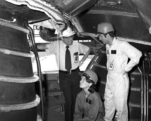 Onlookers get a close look at a space shuttle main engine installed on the B-2 Test Stand at Stennis Space Center