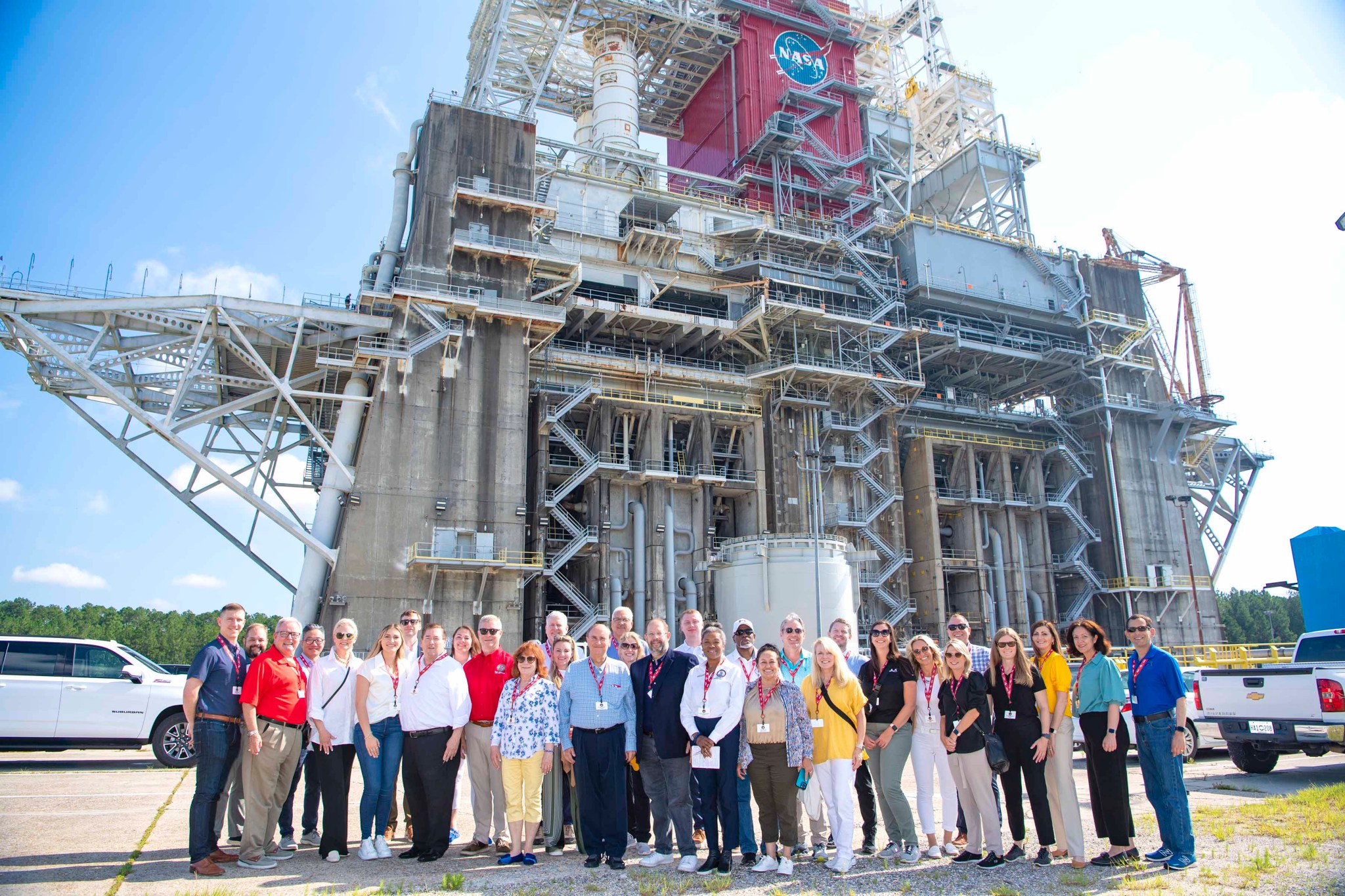 Members of the Aerospace States Association stand at the Thad Cochran Test Stand