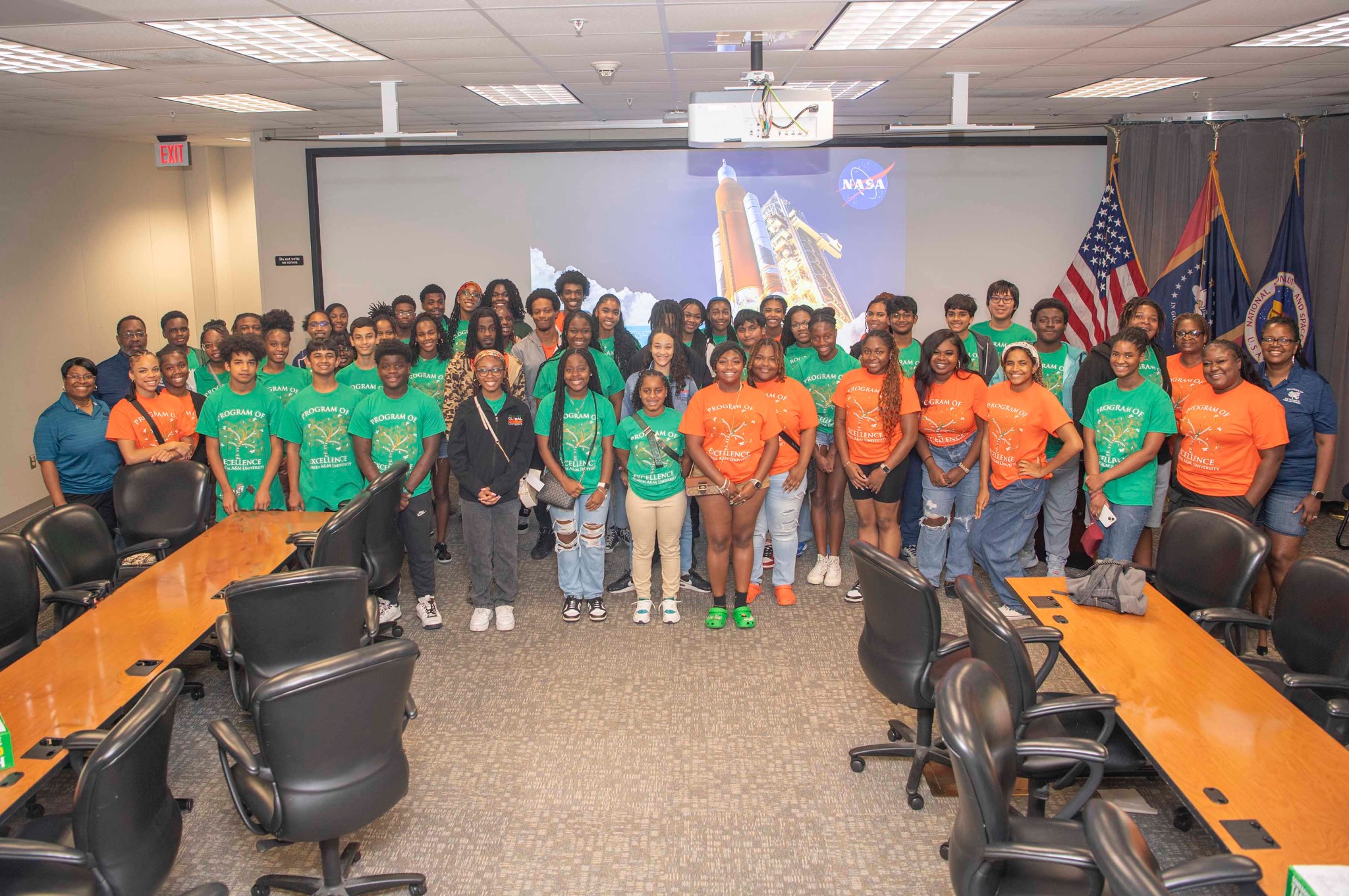 Members of the Florida A&M University Program of Excellence in STEM pose in front of projector screen