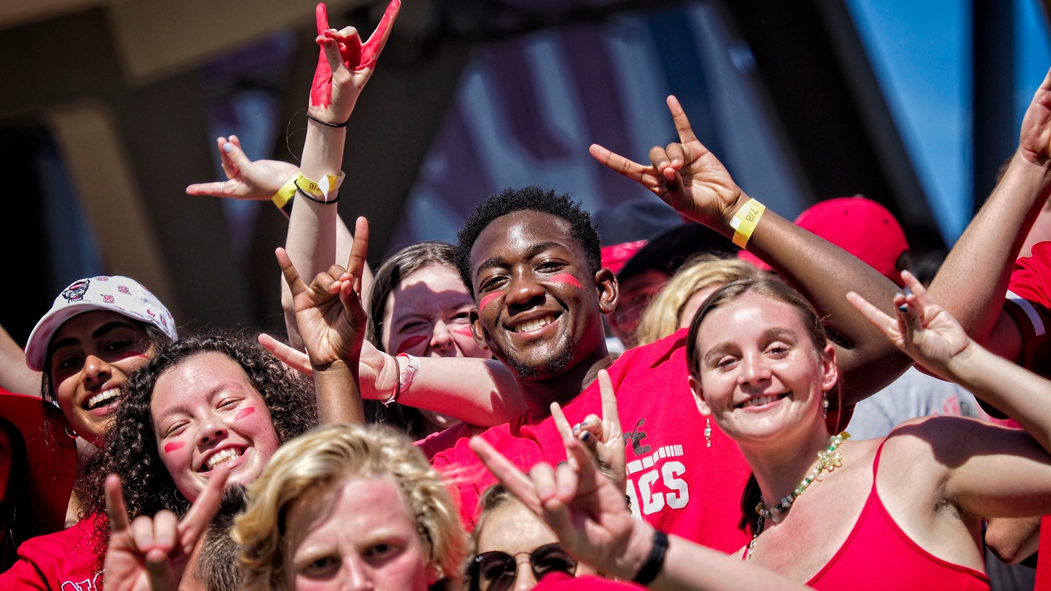 NC State student fans cheer on the Wolfpack during their overtime win over Clemson in 2021.