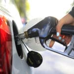 Close-up of a person refueling diesel at a petrol station