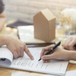 woman putting signature on document contract, real estate purchase, success business contract deals with sale represent.