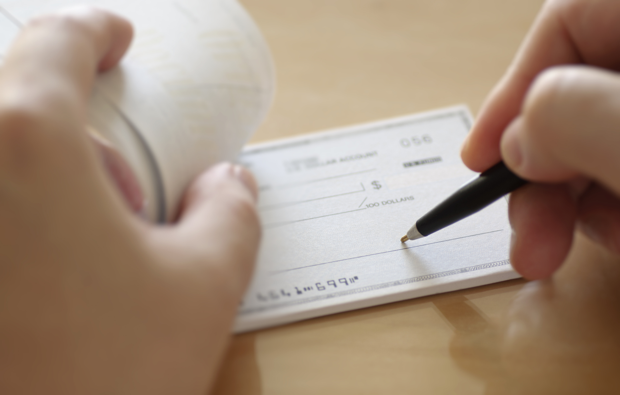 Businessman prepare writing check in the office