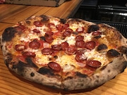 Pepperoni, Razza, Jersey City
Razza owner Dan Richer is a pizza magician, or mad scientist, forever experimenting with new ingredients, combinations and sources. The pepperoni pizza may sound basic - tomato sauce, fresh mozzarella, pepperoni, garlic - but it's a standout.