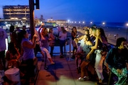 A group of women pose for a photo while at the Watermark overlooking the beach and boardwalk. Wednesday August 1, 2018. Asbury Park, NJ, USA NJ Advance Media for NJ.com