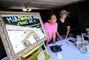 Amanda Escobar, left, and her sister Nicole, owners of Remedee Coffee in Atlantic City, talk to customers at their coffee shop in this 2022 file photo. The New Jersey Department of Health revoked their license to operate out of their parents’ garage.