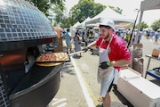 Omar Doukali of Genova Pizza makes pizza at the Jersey Eats Pizza Festival 2024 at Monmouth Park Racetrack in Oceanport, New Jersey, on Saturday, June 22, 2024