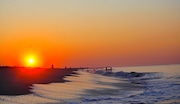 A stunning sunrise awaits you at Cape May Beach.