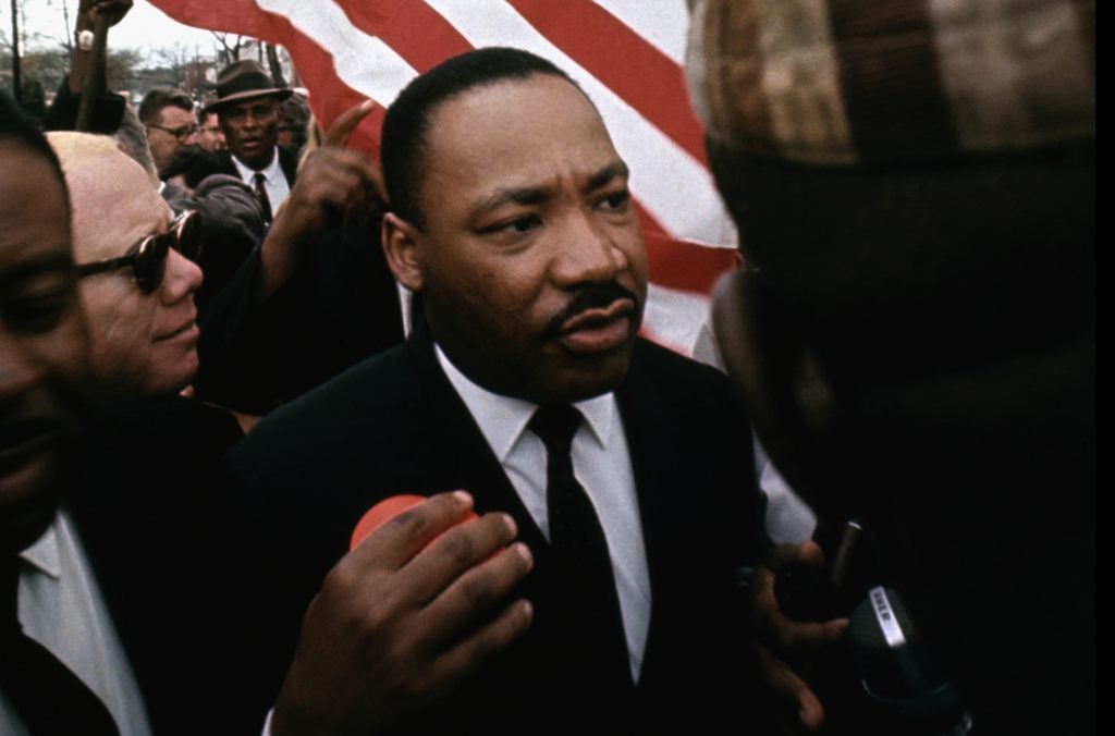 Martin Luther King Jr. marching in Selma